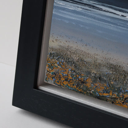 A Glint in the Sand